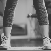 Person standing on vibration plate