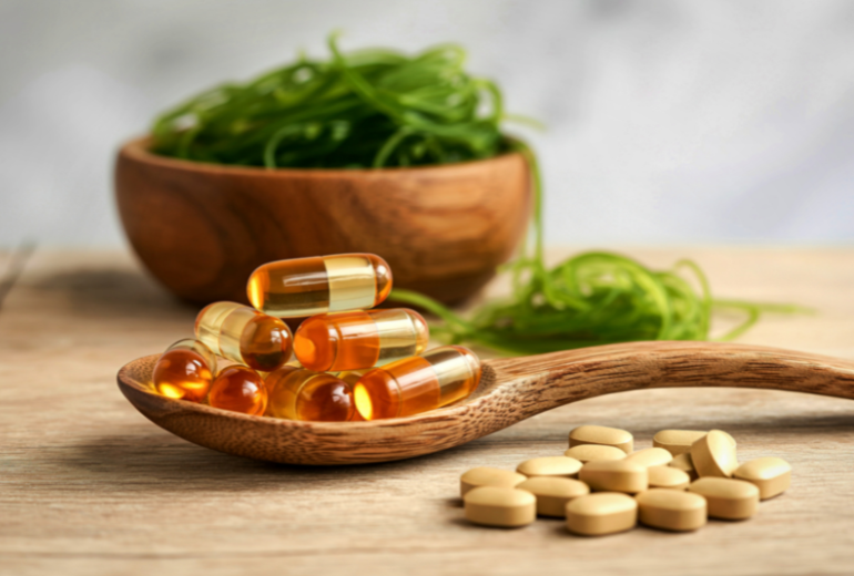 Natural supplements and vitamins on a wooden spoon
