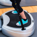 Woman on vibration plate at gym