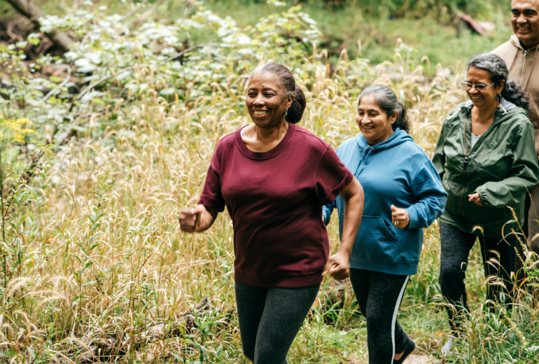 Group of older adults walking in nature